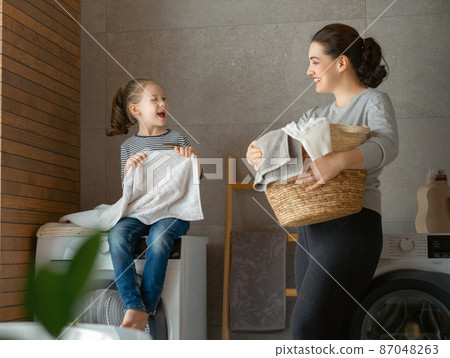 family doing laundry family doing laundry 87048263