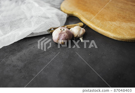 Garlic bulbs on table. Garlic bulbs on table. 87048403