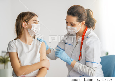 Doctor vaccinating child Doctor vaccinating child 87048796