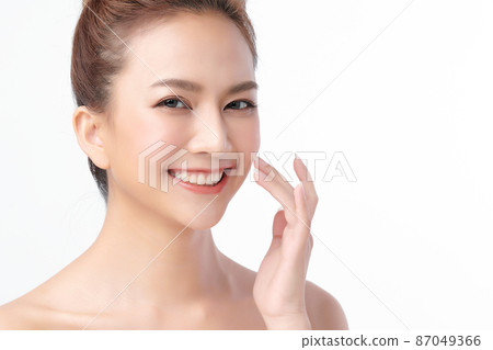 Beautiful young asian woman with clean fresh skin on white background, Face care, Facial treatment, 87049366