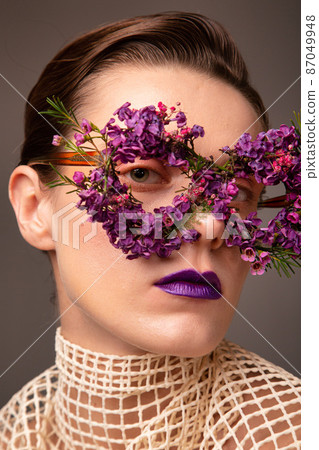 Woman with eye flower mask portrait Woman with eye flower mask portrait 87049948