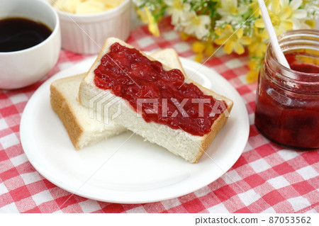 Breakfast of strawberry jam on bread Breakfast of strawberry jam on bread 87053562