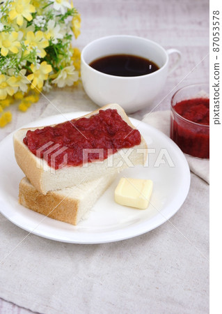 Breakfast of strawberry jam on bread Breakfast of strawberry jam on bread 87053578