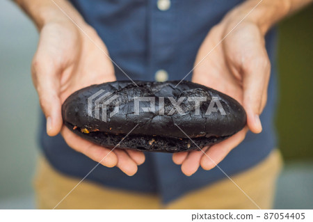 Vietnamese Pork Banh Mi Sandwich in a black baguette Vietnamese Pork Banh Mi Sandwich in a black baguette 87054405