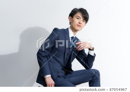 Portrait of a young man in a suit with a white background 87054967