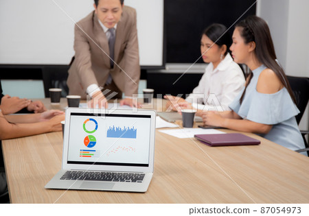 Young businessman or manager meeting with employee in conference room at the office. Young businessman or manager meeting with employee in conference room at the office. 87054973