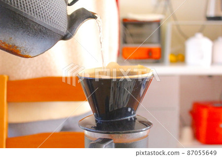 Brew coffee in an iron kettle Brew coffee in an iron kettle 87055649