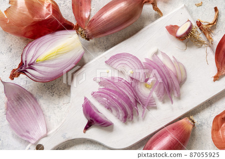 Sliced Red tropea onions on a white board top view Sliced Red tropea onions on a white board top view 87055925