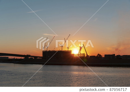 Construction site at dusk 87056717