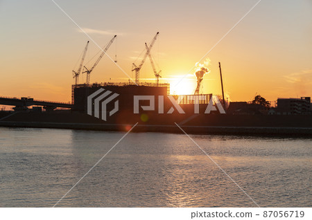 Construction site at dusk 87056719