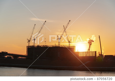 Construction site at dusk 87056720