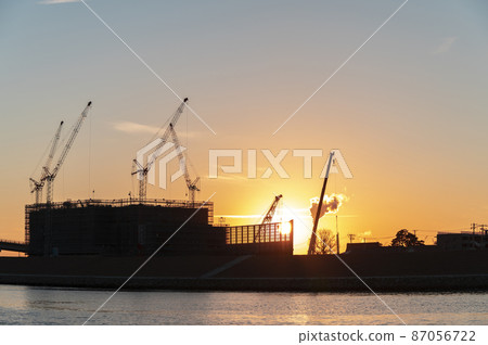 Construction site at dusk 87056722