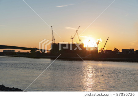 Construction site at dusk 87056726