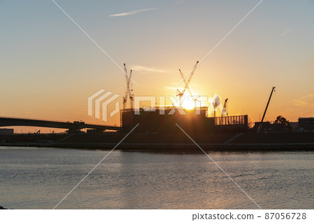 Construction site at dusk 87056728