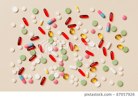 Protective face masks or surgical masks, medicine pills and thermometer on table background. Coronavirus disease. Corona virus concept. Space for text 87057926