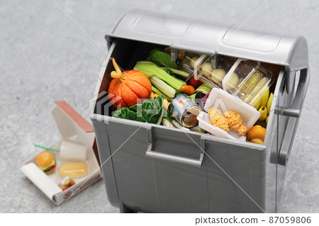 Trash can full of food waste (miniature photo) 87059806