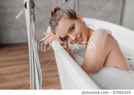 Woman Taking Bath. Young Beautiful Lady Taking Bath At Home Stock