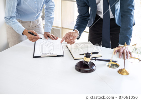 Businesswoman and Male lawyer or judge consult and conference having team meeting with client at law firm in office, Law and Legal services concept 87061050
