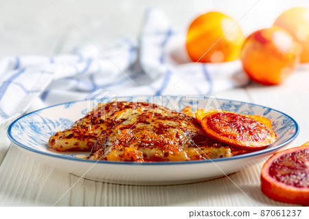 Homemade French pancakes with orange sauce. Homemade French pancakes with orange sauce. 87061237