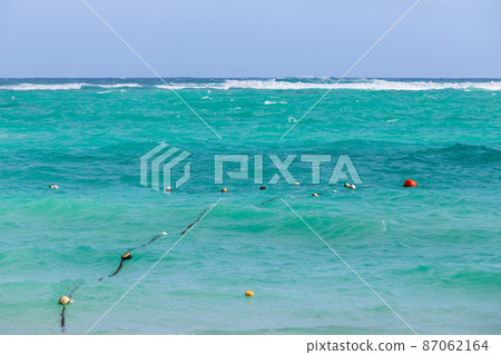 Atlantic ocean, shore water with buoys and ropes 87062164
