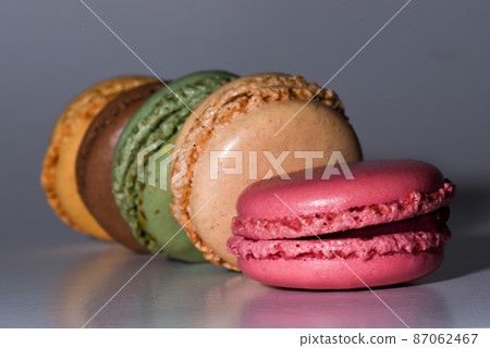 Den Helder, the Netherlands. January 2022. A stack of macarons on a grey background. Den Helder, the Netherlands. January 2022. A stack of macarons on a grey background. 87062467
