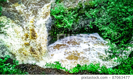 Natural waterfalls in nature with vibrant trees Natural waterfalls in nature with vibrant trees 87063477