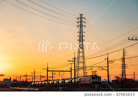"Saitama Prefecture" Musashino Line / freight train running in the setting sun 87063613
