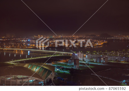 The architecture shimmering under the night-lit city makes the city more vibrant in Da Nang, Vietnam 87065592