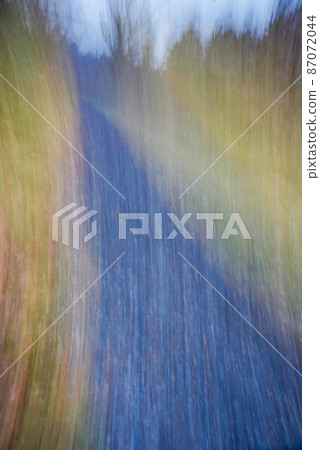 Abstracy nature background path with autumn foliage 87072044