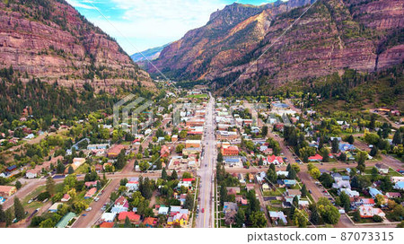 Town of Ouray tucked into flat valley surrounded by mountains Town of Ouray tucked into flat valley surrounded by mountains 87073315