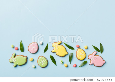 holiday preparation Multi colors Easter eggs with cookies on colored background . Pastel color Easter eggs. holiday concept with copy space holiday preparation Multi colors Easter eggs with cookies on colored background . Pastel color Easter eggs. holiday concept with copy space 87074533