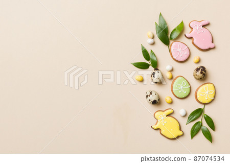holiday preparation Multi colors Easter eggs with cookies on colored background . Pastel color Easter eggs. holiday concept with copy space holiday preparation Multi colors Easter eggs with cookies on colored background . Pastel color Easter eggs. holiday concept with copy space 87074534