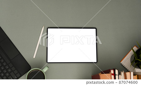 Overhead shot, A modern workspace with digital tablet on grey background. 87074600