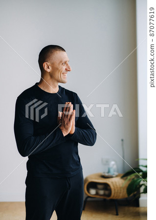 male athlete Standing in the gym before yoga classes 87077619