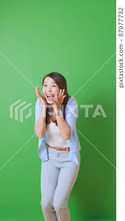 asian woman with green background asian woman with green background 87077782