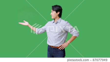 businessman with green background 87077949