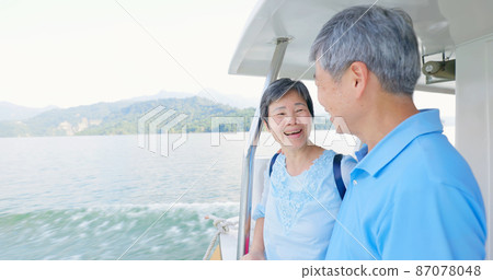 elder couple on boat elder couple on boat 87078048