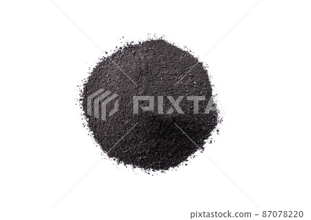 Dry black cosmetic clay isolated on white background. Heap of black charcoal cosmetic clay. Dry black cosmetic clay isolated on white background. Heap of black charcoal cosmetic clay. 87078220