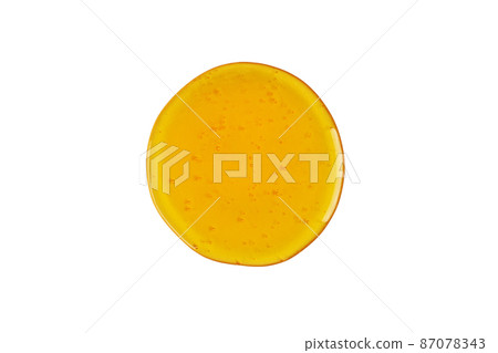 Sweet honey drop isolated on white background. Abstract honey, wax drop. 87078343