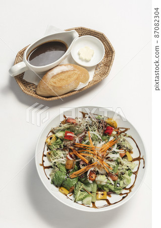 mixed organic vegetable salad on white background 87082304