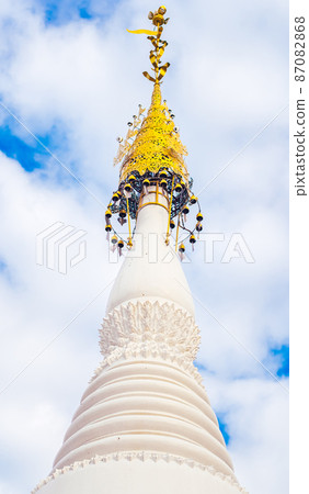 Ancient traditional Pagoda in white white ornament on top with gold in Myanmar 87082868