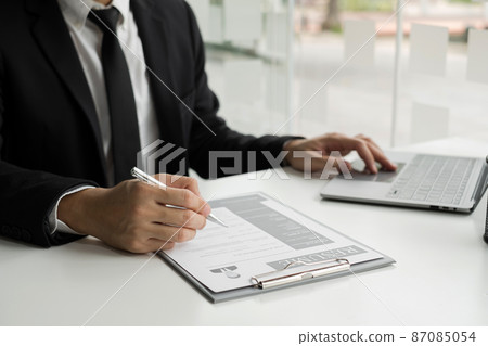 Business people hold a resume and talk to job applicants for job interviews about careers and Their personal history in the company. Recruitment concepts 87085054