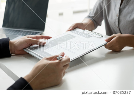 Business people hold a resume and talk to job applicants for job interviews about careers and Their personal history in the company. Recruitment concepts 87085287