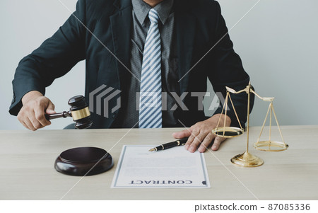 Professional man lawyers work at a law office There are scales, Scales of justice, judges gavel, and litigation documents. Concepts of law and justice 87085336