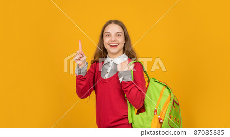 happy inspired with idea teen girl with school backpack on yellow background, school 87085885