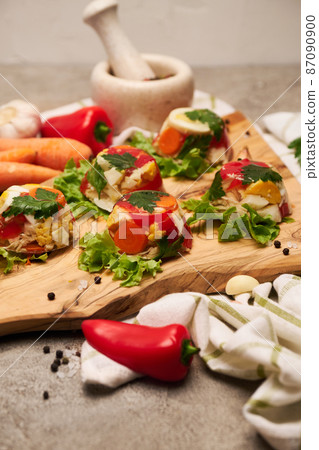 Portion of delicious chicken aspic on serving board on concrete table Portion of delicious chicken aspic on serving board on concrete table 87090900