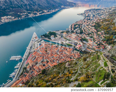 Old city. Kotor. Montenegro. Narrow streets and old houses of Kotor at sunset. View of Kotor from the city wall. View from above Old city. Kotor. Montenegro. Narrow streets and old houses of Kotor at sunset. View of Kotor from the city wall. View from above 87090957