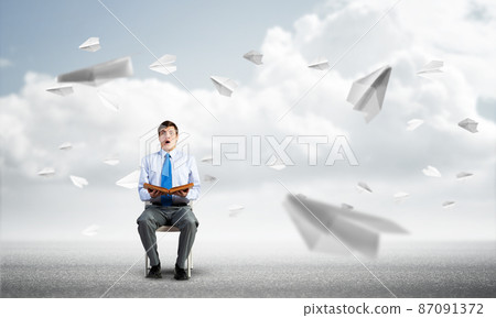 young businessman with book 87091372