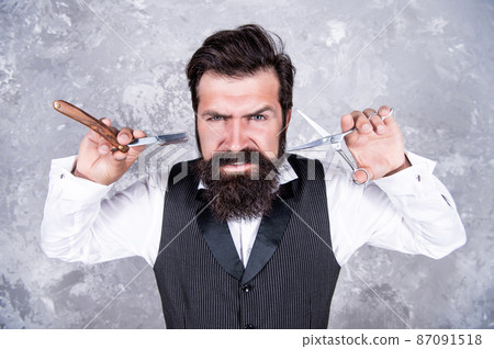 Clean cuts. hairdresser scissors. mature professional barber hold vintage shaver. 87091518