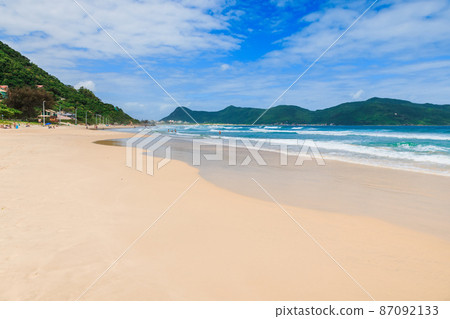 Sandy beach with amazing rocks and ocean waves Sandy beach with amazing rocks and ocean waves 87092133